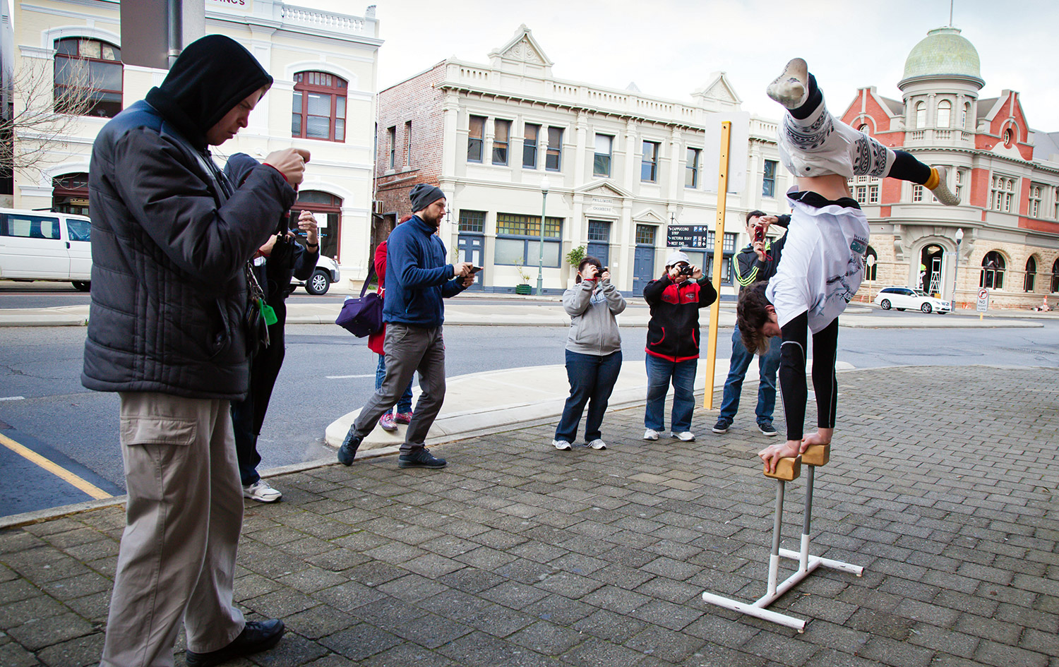 Participants taking photographs of circus performer at As We Are's Photography Workshop, Fremantle