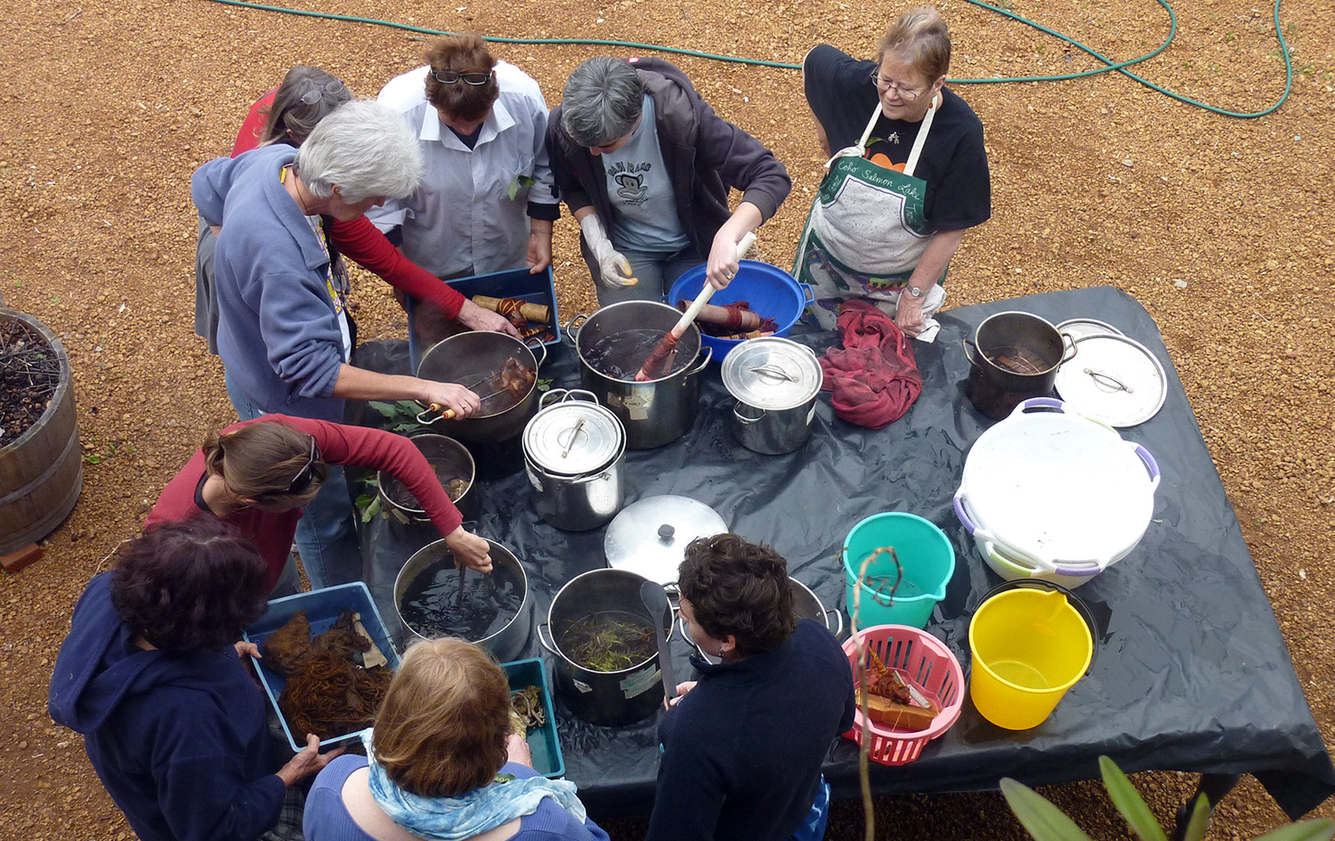 Participants dyeing their textiles in pots at the natural Dyeing workshop with Trudi Pollard